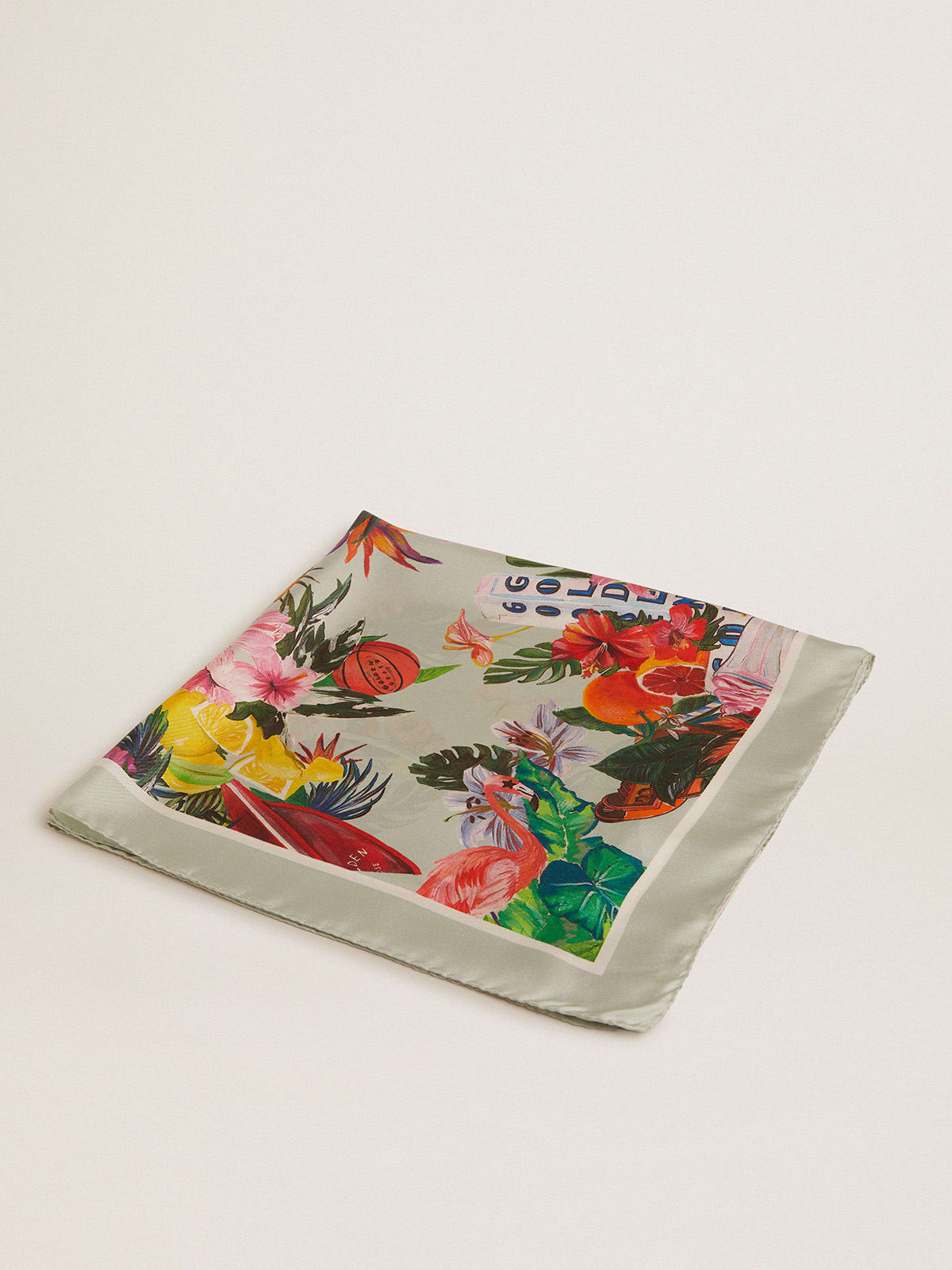 Mint-green silk scarf with multicolored tropical print