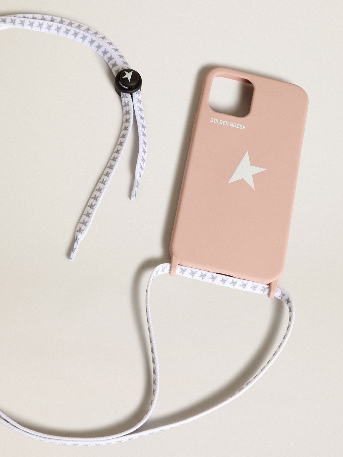 Pale pink iPhone 12 and 12 Pro case with contrasting white logo and logo lanyards