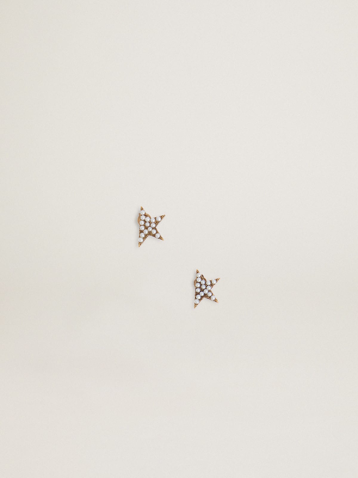 Star Jewelmates Collection stud earrings in old gold color with decorative beads