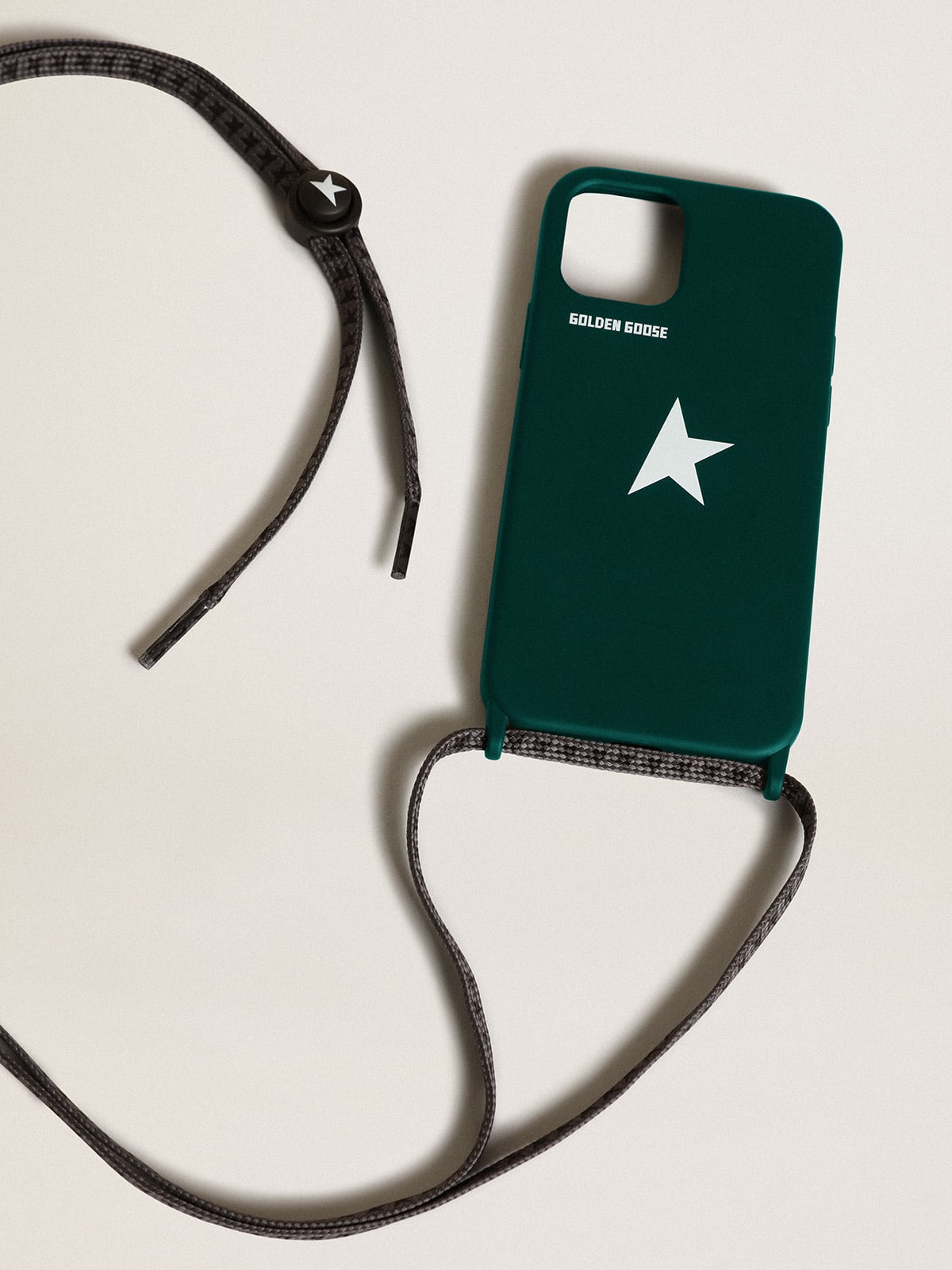 Green iPhone 12 and 12 Pro case with contrasting white logo and logo lanyards