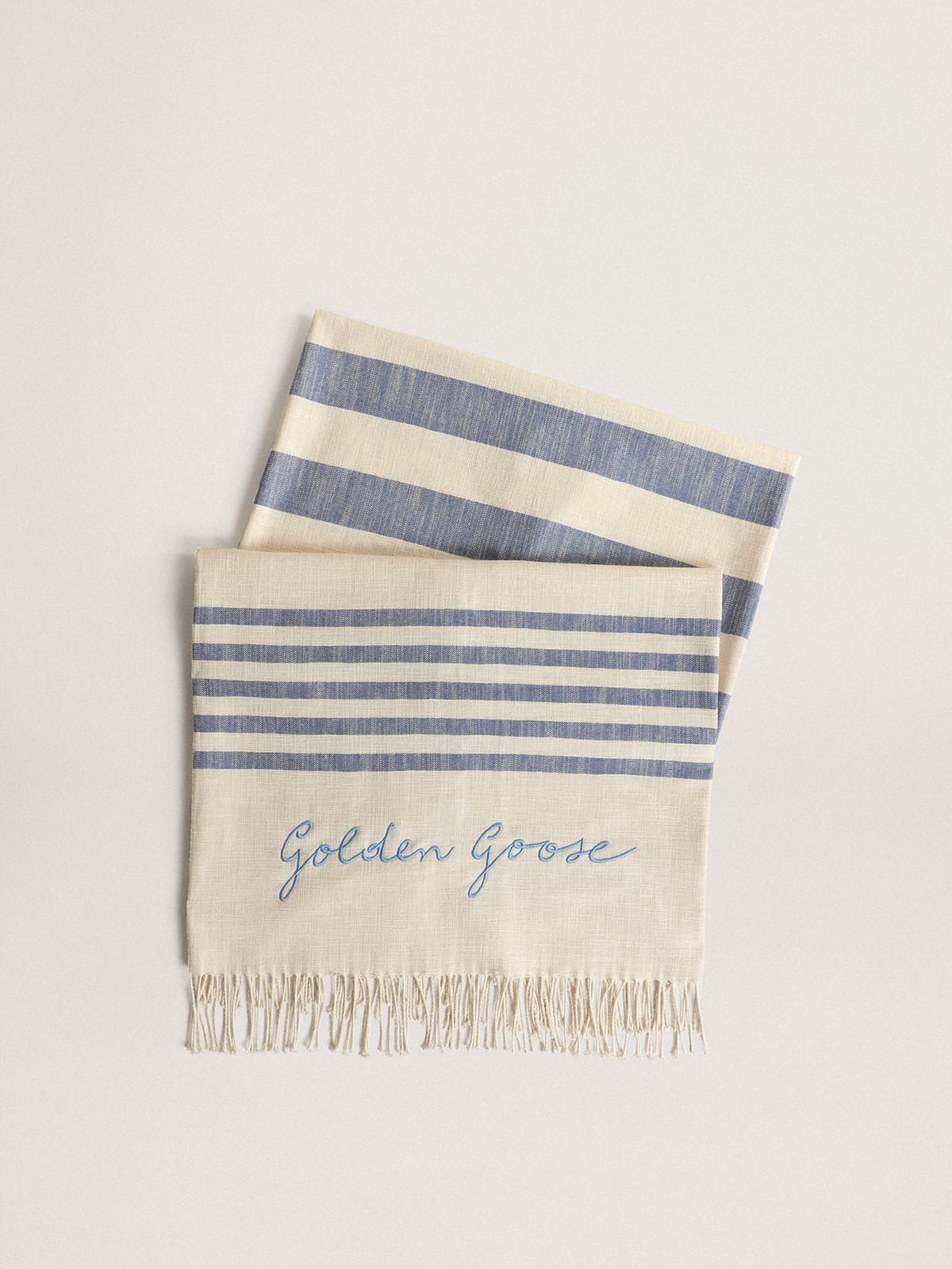 Resort Collection cotton beach towel with blue stripes and fringing