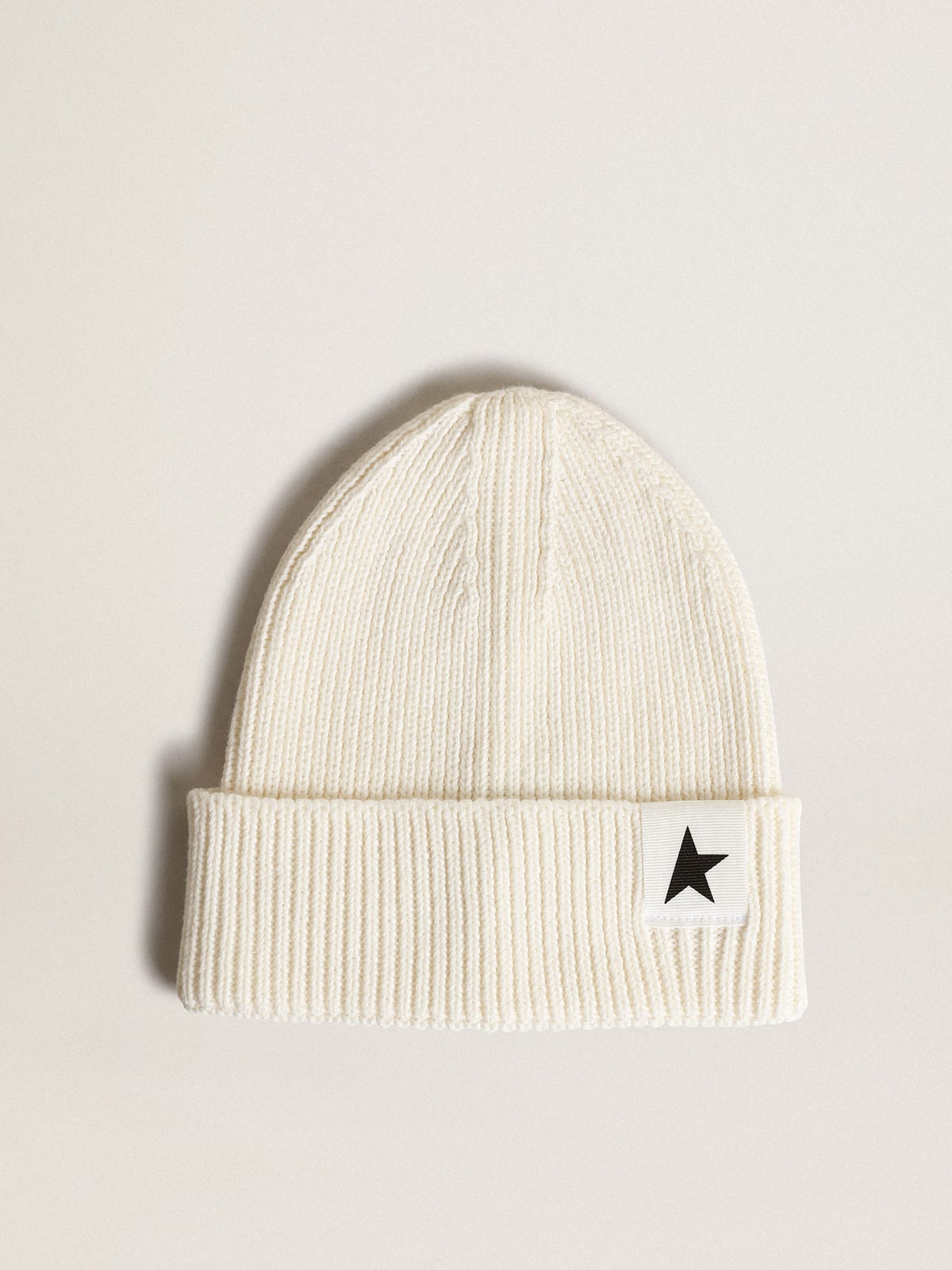 Off-white cotton beanie with contrasting black star