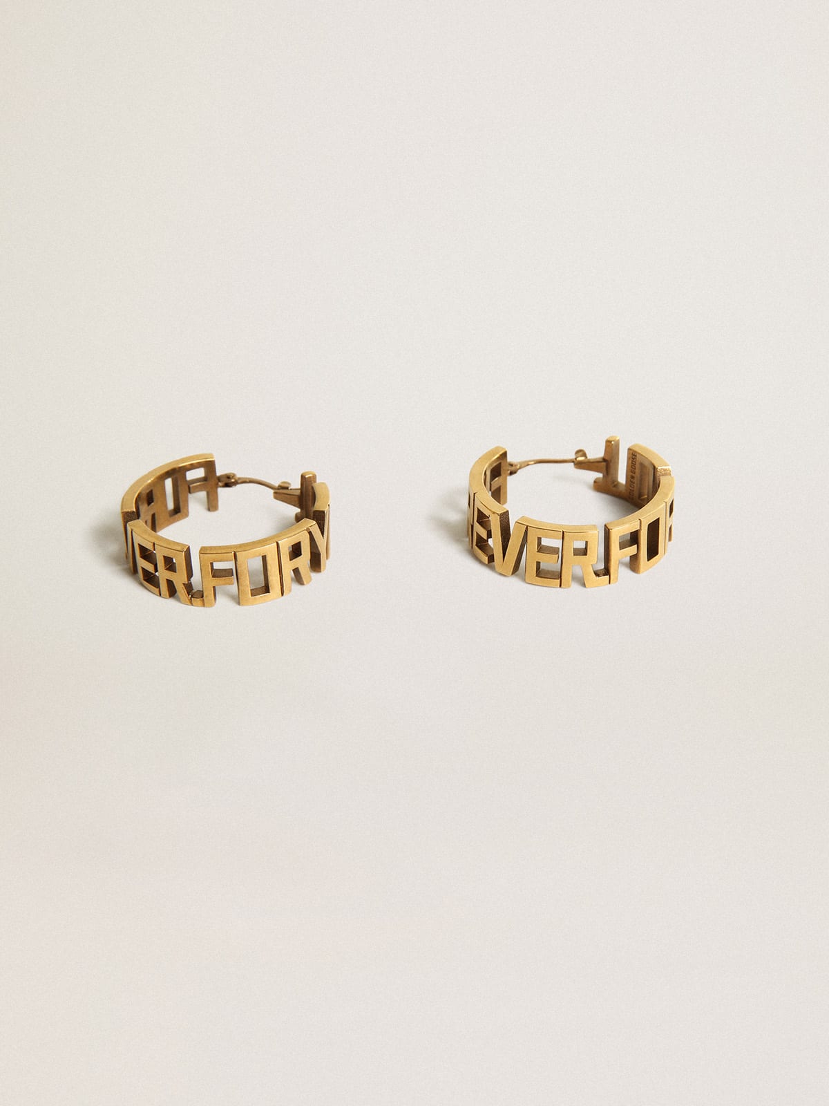 Hoop earrings in old gold color with Forever For You lettering