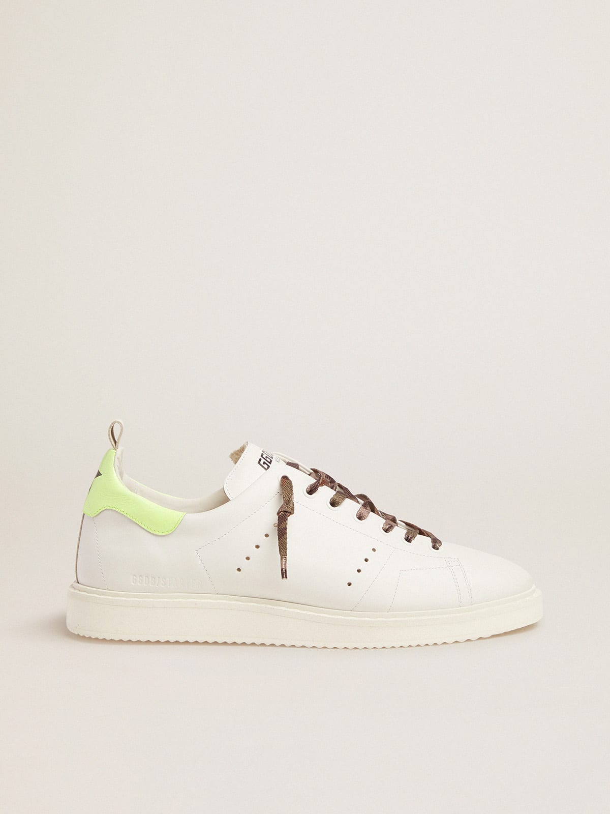 White Starter LTD sneakers with fluorescent yellow heel tab