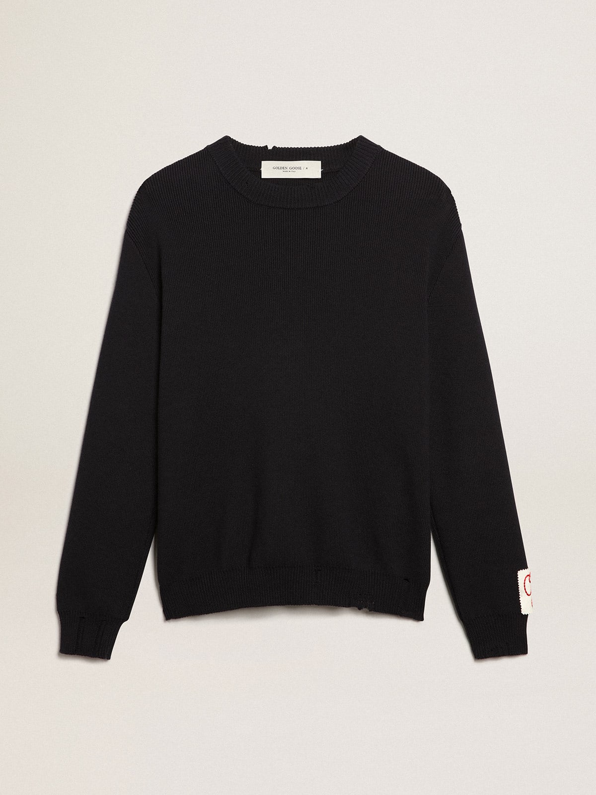 Round-neck sweater in dark blue cotton with a distressed treatment