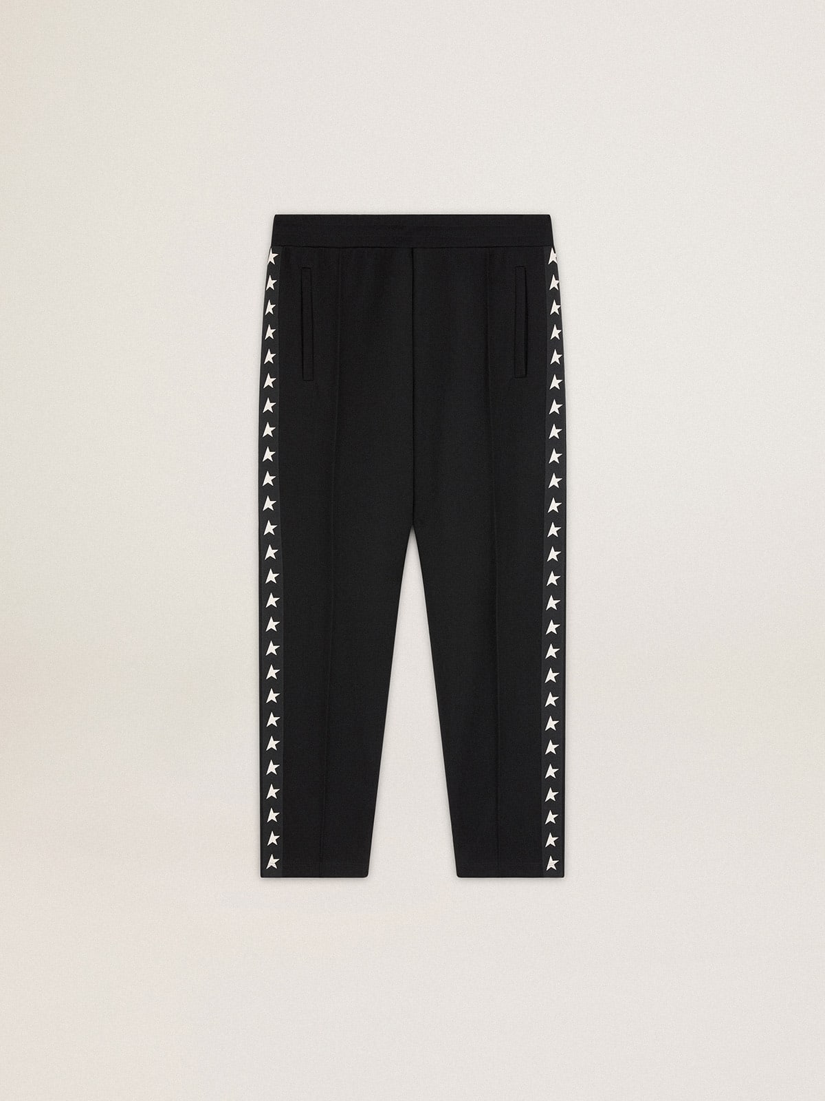 Men's black joggers with white stars on the sides