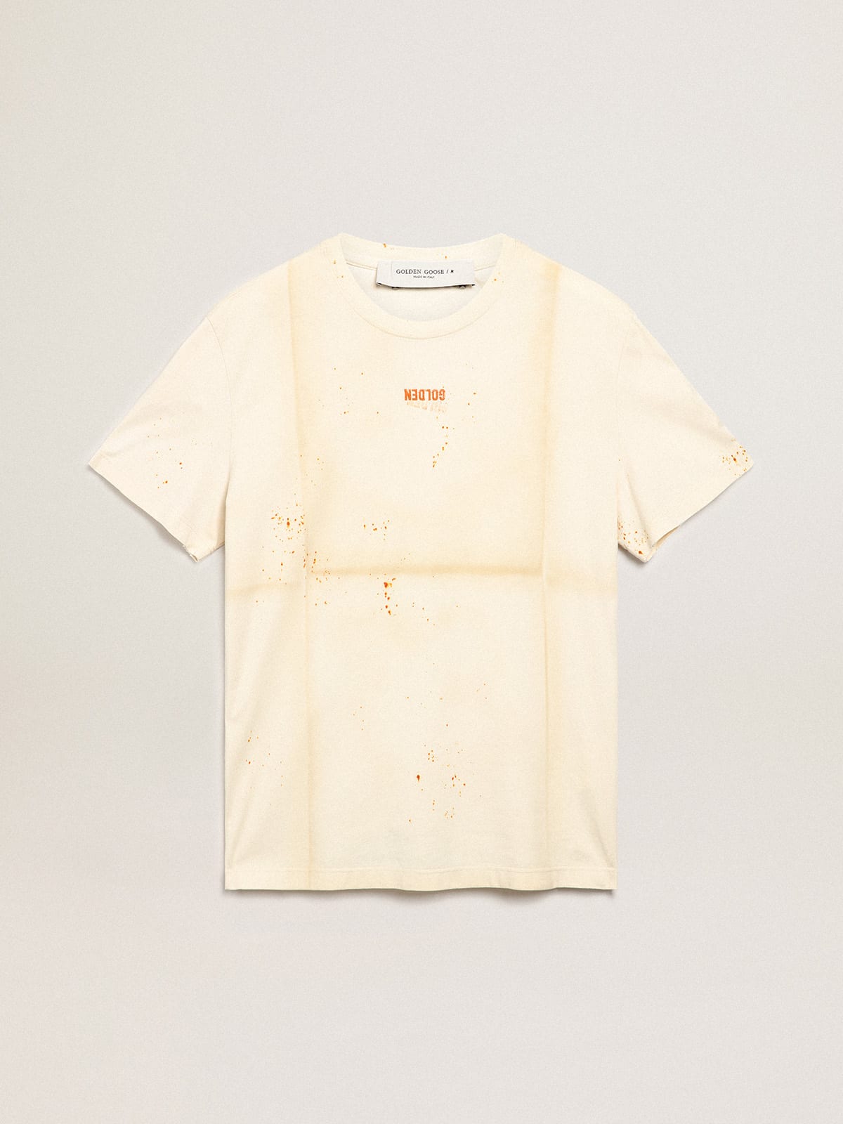 Bone-white Journey Collection T-shirt with a folded-garment effect with Golden lettering and rust-colored spray