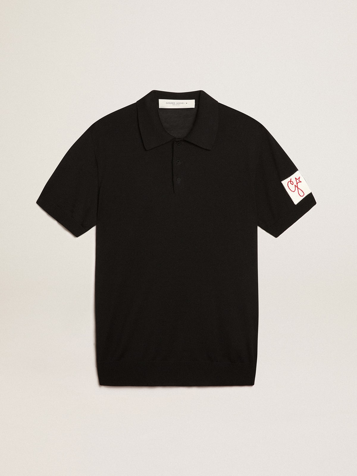 Men's short-sleeved polo shirt in black merino wool