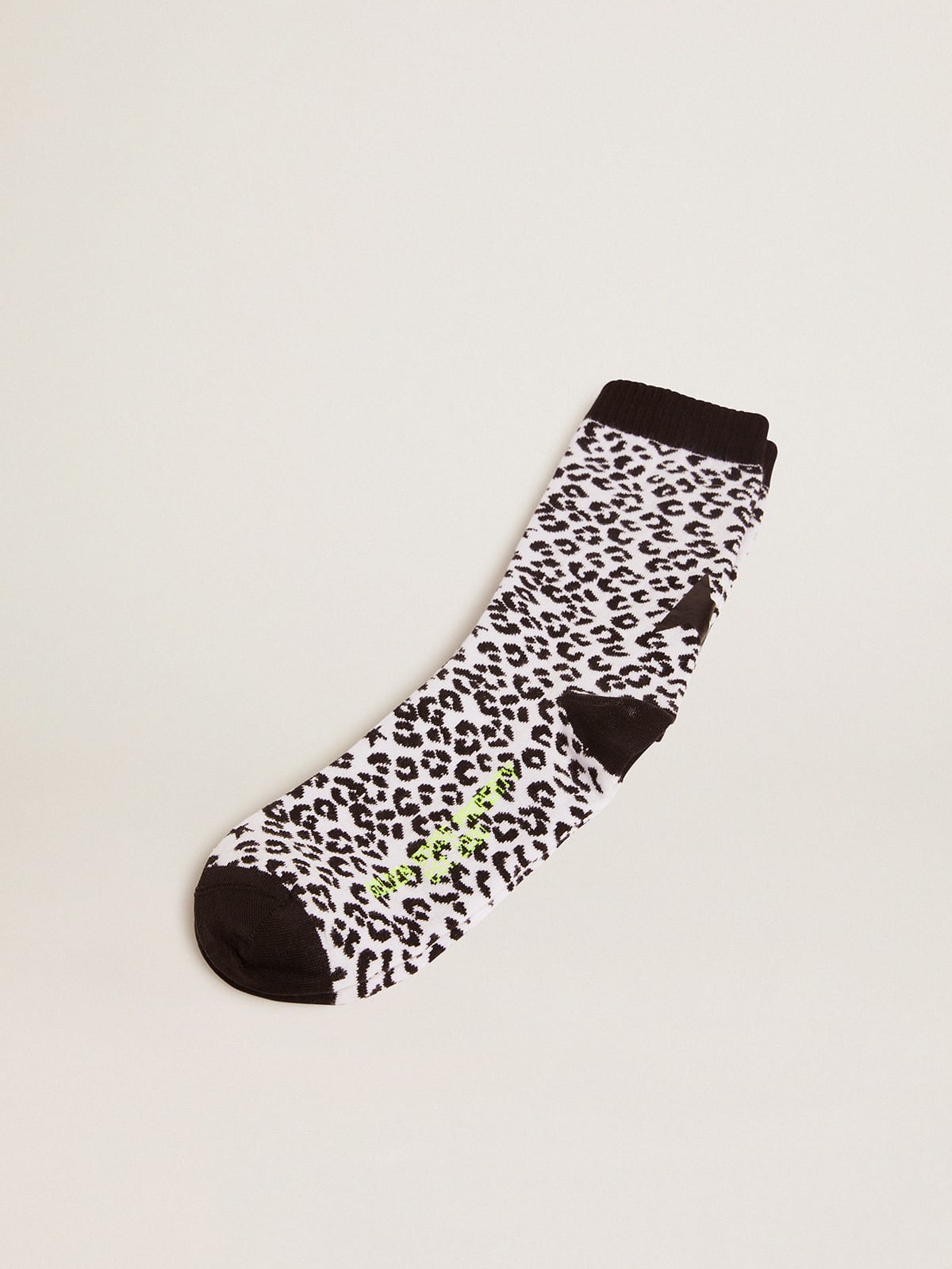 Black and white socks with leopard print and black star on the back