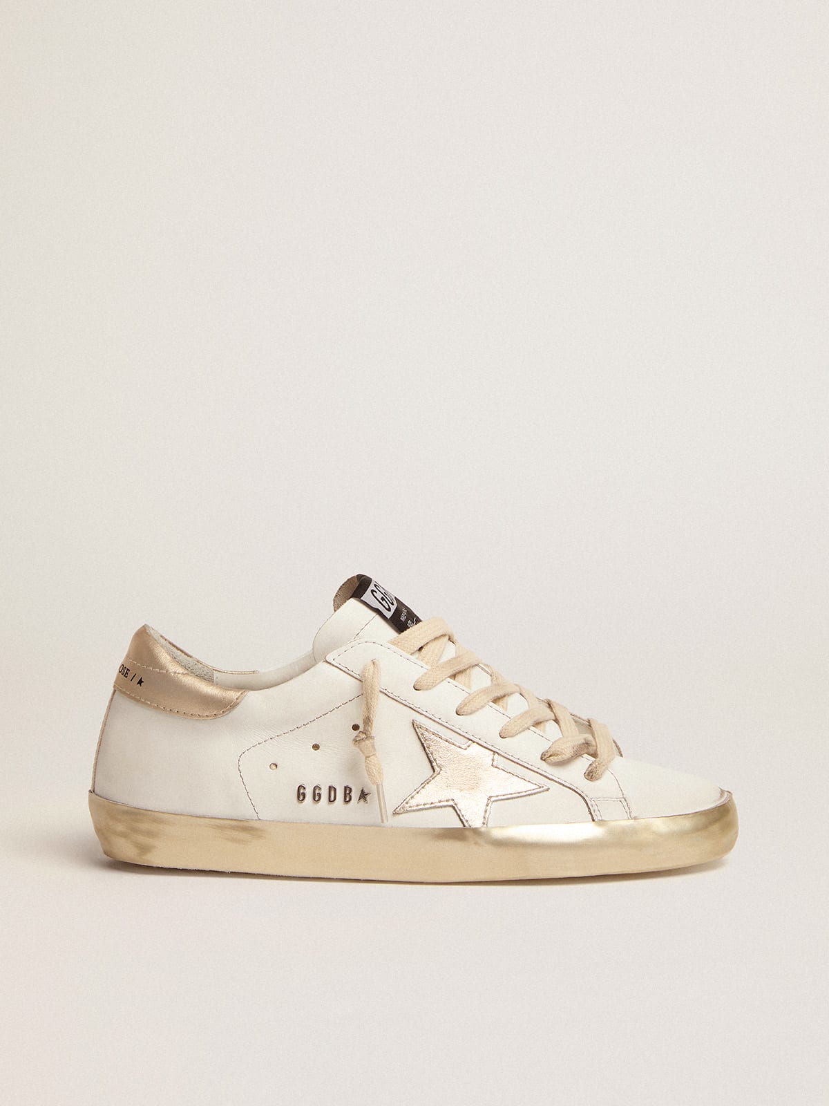 Women's Super-Star sneakers with gold sparkle foxing and metal stud lettering