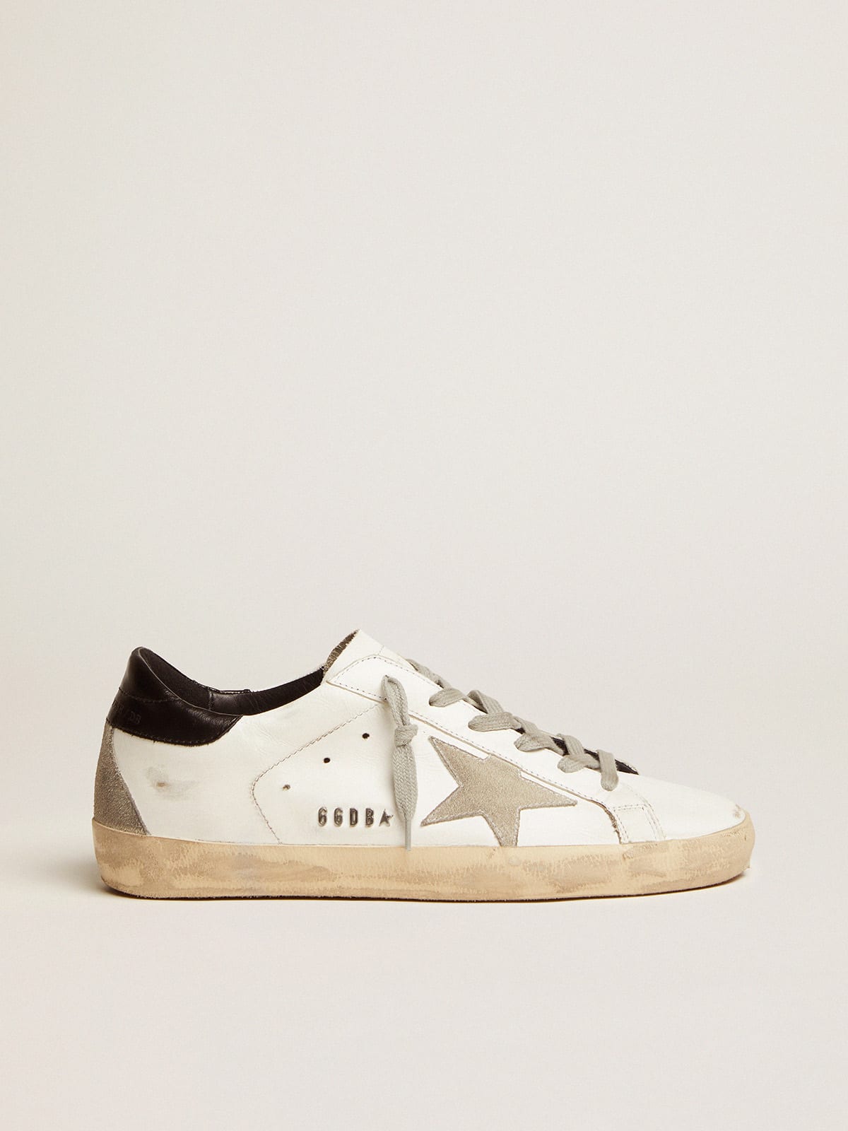 Women's Super-Star sneakers with black heel tab and metal stud lettering