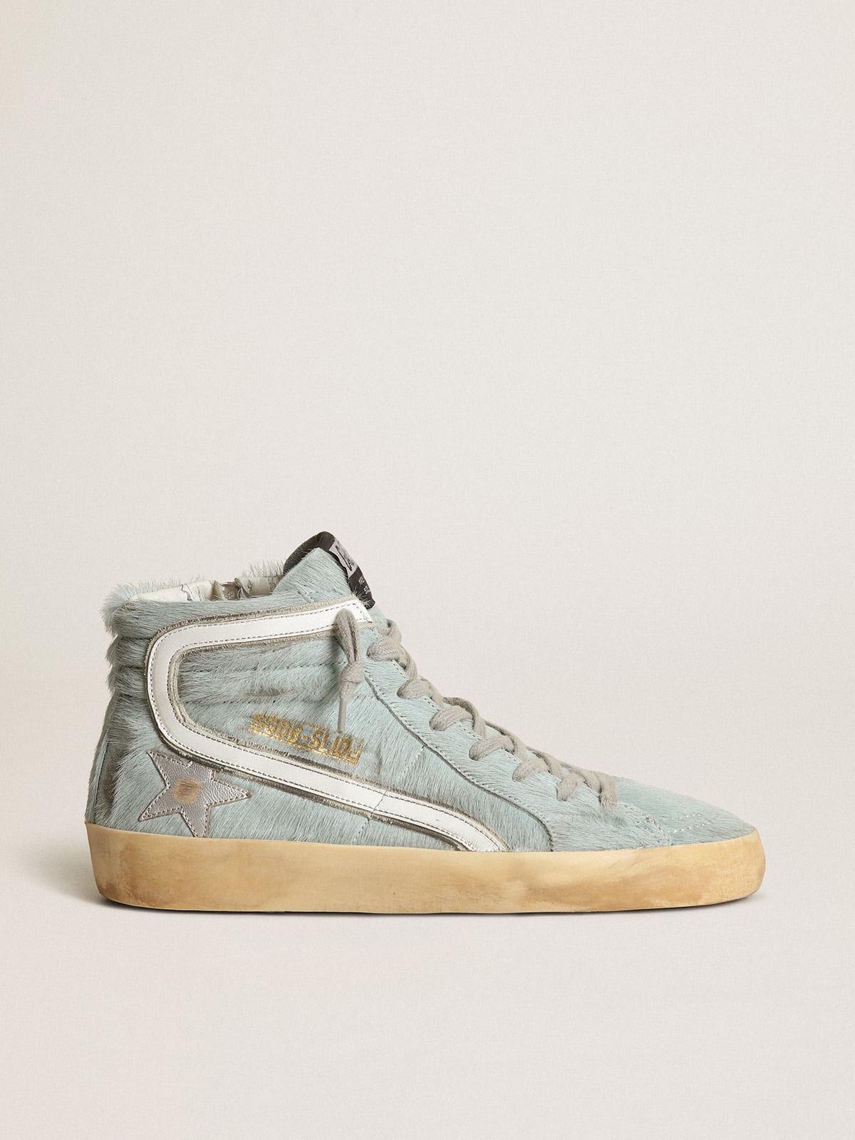 Slide sneakers in aquamarine pony skin with silver laminated leather star