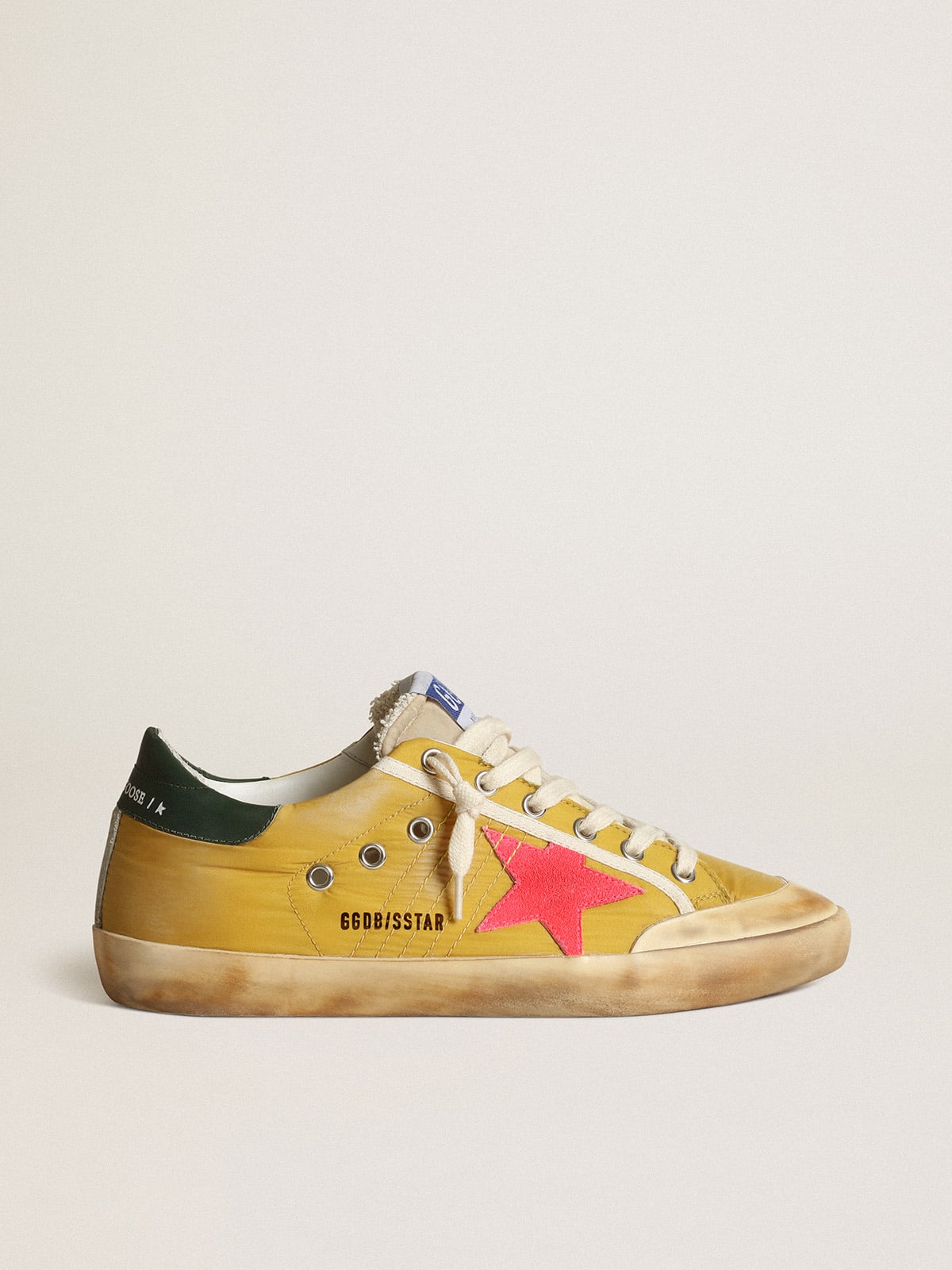 Super-Star Penstar sneakers in mustard-colored nylon with fluorescent lobster-colored suede star