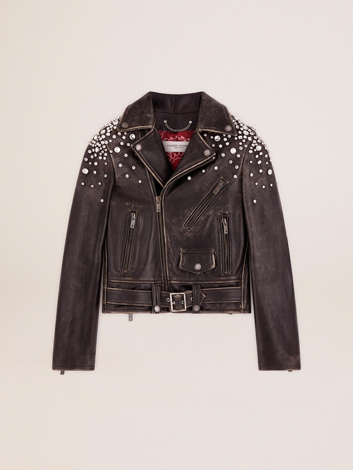 Biker jacket in distressed leather with cabochon crystals