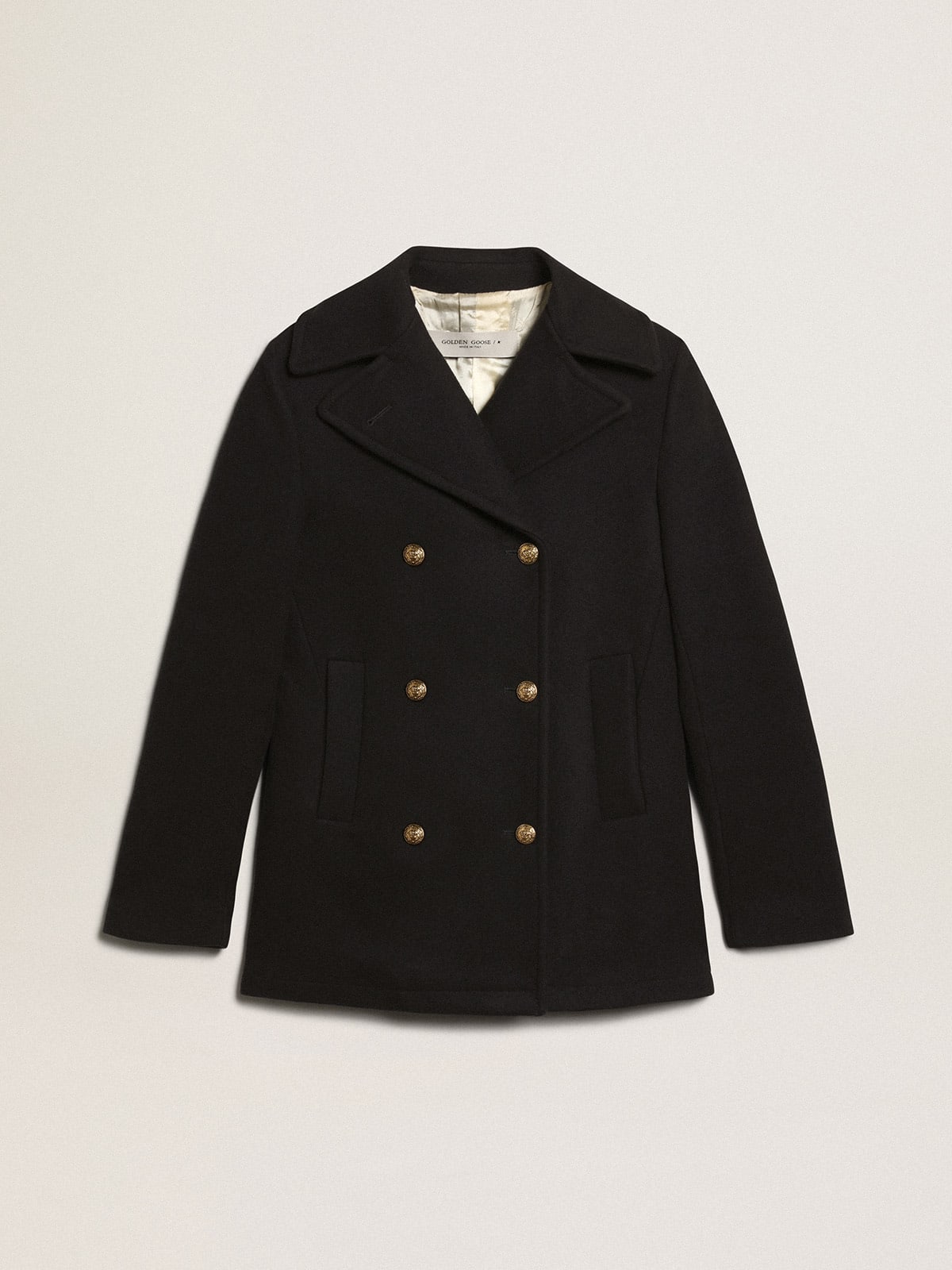 Women's dark blue peacoat with gold-colored heraldic buttons
