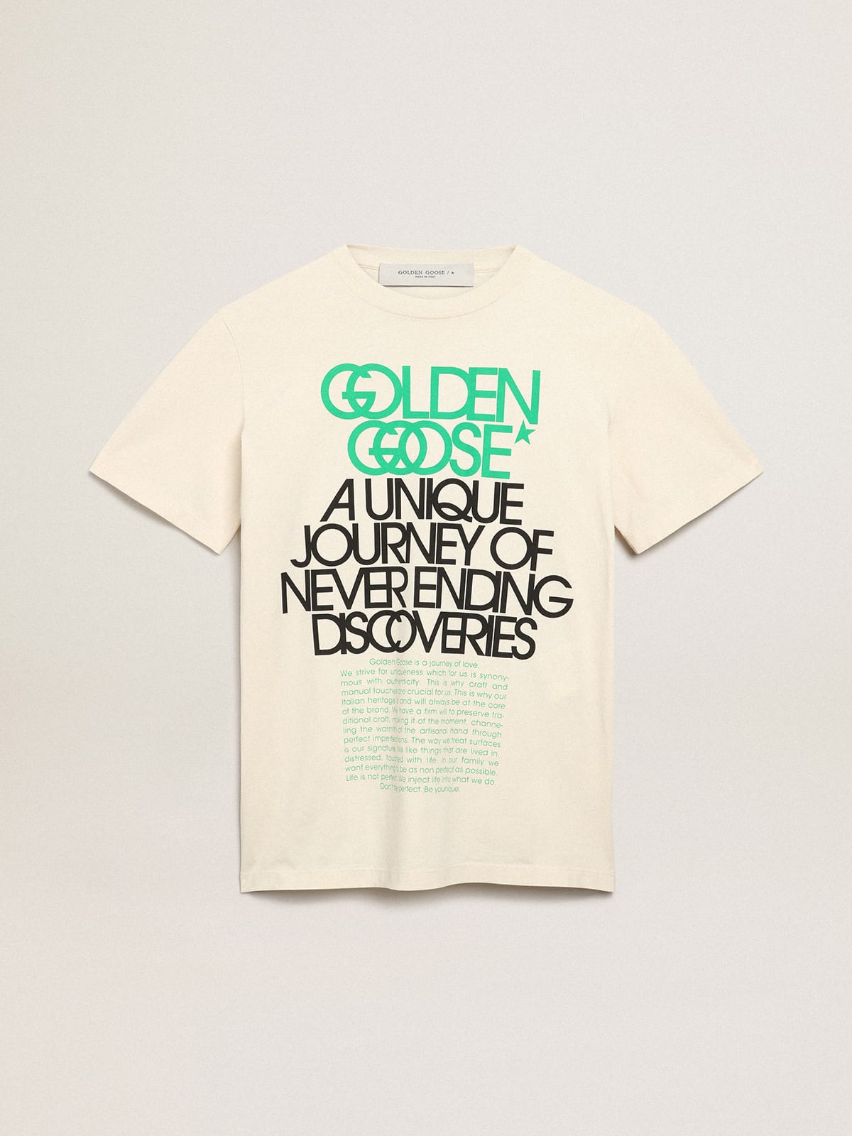 Bone-white Journey Collection T-shirt with black and bright-green lettering on the front